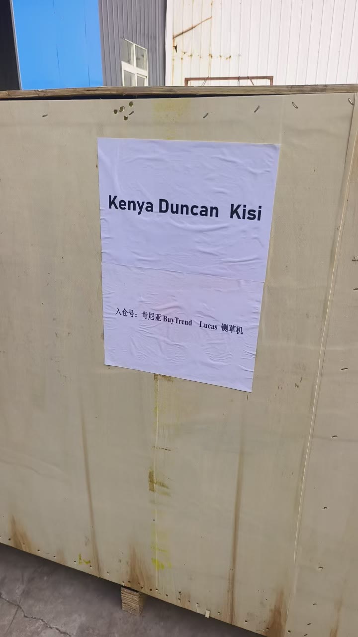 A large timber shipping crate in a factory yard, labelled Kenya Duncan Kisi for export