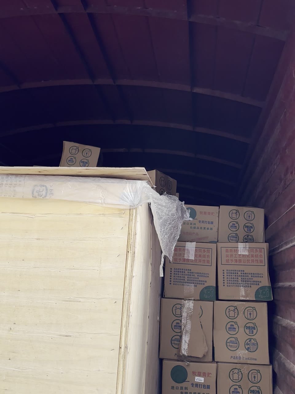 The boxed baler wrapper and cartons of film loaded inside the truck