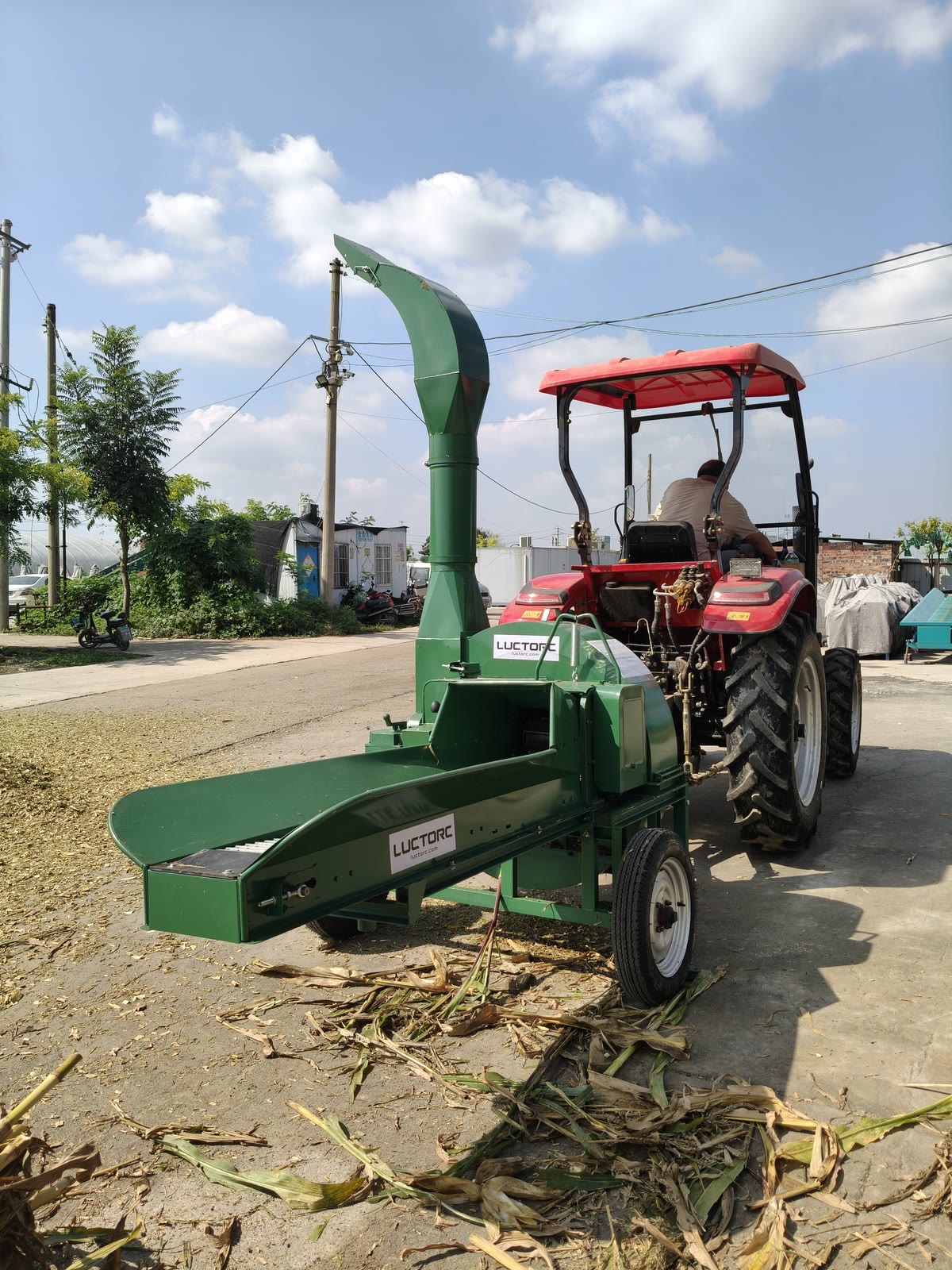 Intake-side view of George's chaff cutter and tractor at the supplier's test yard